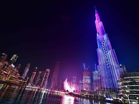 Dubai's Burj Khalifa, the worlds tallest building is illuminated during festivities marking the one-year countdown to Expo 2020 Dubai, on October 20, 2019