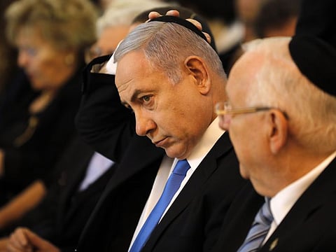 Israeli Prime Minister Benjamin Netanyahu (L) and President Reuven Rivlin at a ceremony.