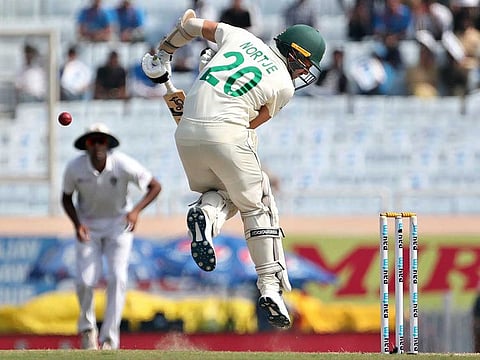 South Africa's Anrich Nortje evades a rising delivery from India's Mohammed Shami during the fourth day of third and last cricket test match between India and South Africa in Ranchi, India, Tuesday, Oct. 22, 2019.