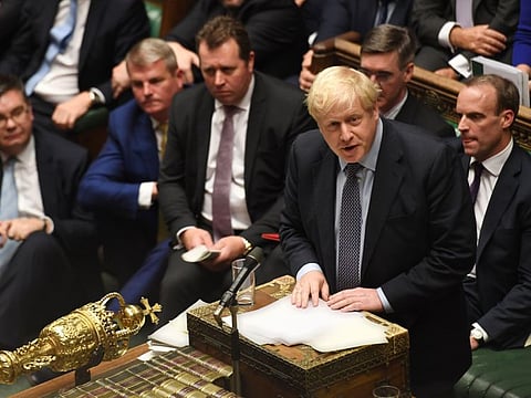 Britain's Prime Minister Boris Johnson (R) speaking in the House of Commons in London on October 19, 2019, during a debate on the Brexit deal