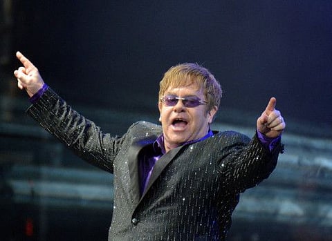 (FILES) In this file photo taken on June 30, 2012 British singer Elton John performs during his charity concert at the Euro 2012 football championships fanzone, in Kiev. British rock legend Elton John says Watford football club were his unlikely saviour as he experienced the "worst period of my life" in the 1980's / AFP / Sergei SUPINSKY