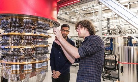 A handout picture from October 2019 shows Sundar Pichai and Daniel Sank (R) with one of Google's Quantum Computers in the Santa Barbara lab, California.