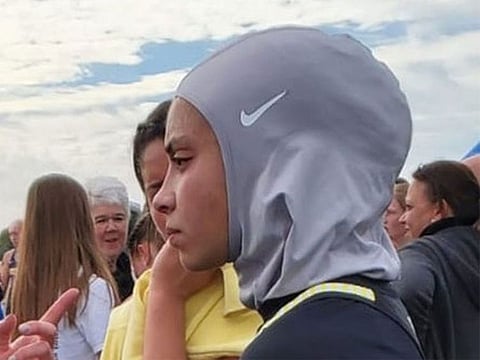 Noor Alexandria Abukaram, 16, was disqualified from a cross country race because she did not have a waiver to wear her hijab.