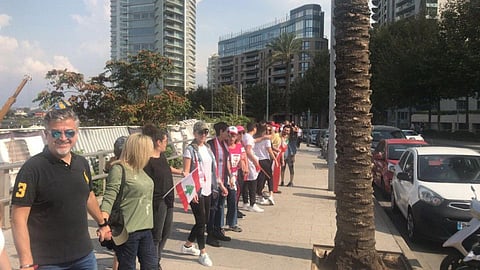 Lebanese gather to form human chain.