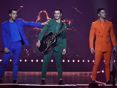 Recording artists Joe Jonas, Kevin Jonas and Nick Jonas of Jonas Brothers perform during a stop of the group's Happiness Begins Tour at MGM Grand Garden Arena on October 18, 2019 in Las Vegas, Nevada.