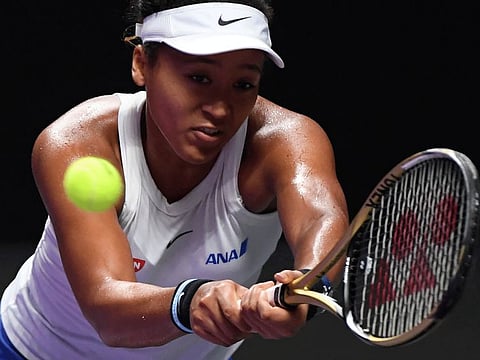 Naomi Osaka stretches for a backhand return against Petra Kvitova in the opening match of WTA Finals, a season-ending event for the top eight women's players on the Tour, last year.