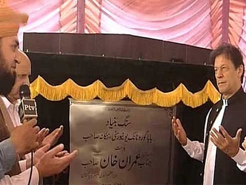 Pakistan Prime Minister Imran Khan lays foundation stone of Bab Guru Nanak University in Punjab on Monday.