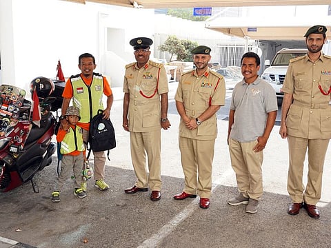 Dubai Police receives Indonesian traveler and son.