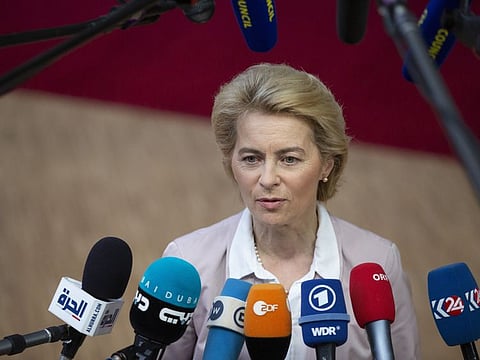 Incoming European Commission President Ursula von der Leyen speaks with the media as she arrives for an EU summit in Brussels.