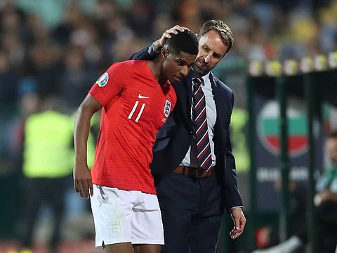 Marcus Rashford is comforted by England coach Gareth Southgate during the match against Bulgaria.