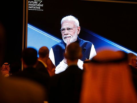 Participants watch Indian Prime Minister Narendra Modi on a screen during his speech at the Future Investment Initiative forum in Riyadh, Saudi Arabia, Tuesday, Oct. 29, 2019. The long-planned initial public offering of a sliver of Saudi Arabia's state-run oil giant Saudi Aramco will see shares traded on Riyadh's stock exchange in December, a Saudi-owned satellite news channel reported Tuesday as the kingdom's marquee investment forum got underway.