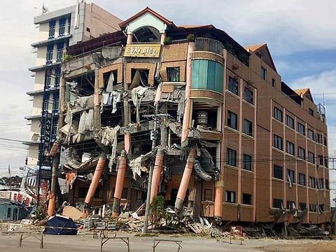 Eva's Hotel stands damaged after a strong earthquake in Kidapawan, north Cotabato province, Philippines.