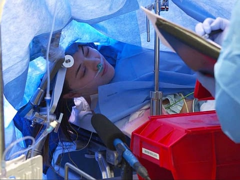 Jenna Chardt, 25, remains conscious while neurosurgeons perform brain surgery.