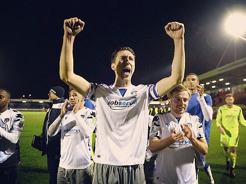 Colchester celebrate their League Cup win over Crawley Town.