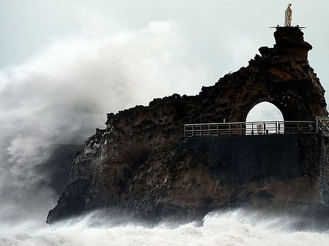 Waves break on the Rocher de La Vierge off the coast in Biarritz, south western France, on November 3, 2019 during the Amelie storm.