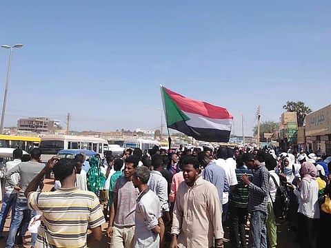 Protesters march in Wad Madani, the provincial capital of al-Jazirah province, Sudan, Sunday, Nov. 3, 2019.