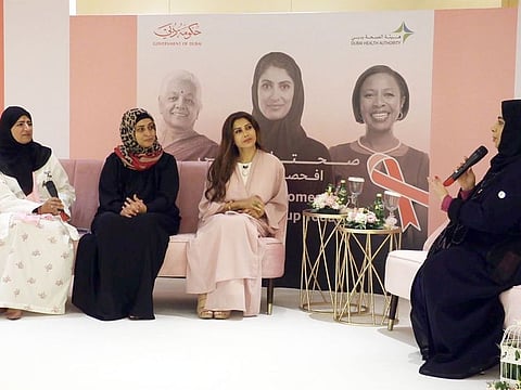Cancer survivor Rolla Ismail (second left) has been cancer free for the last five years. She discussed her journey with doctors during a panel discussion