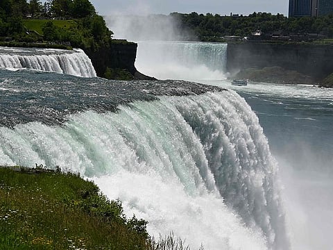 The American Falls are seen from the US side at Niagara Falls State Park in Niagara Falls, New York on June 22, 2019. An iron boat stuck above Niagara Falls for more than a century has moved because of severe weather, a park official said.