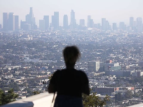 People gather at Griffith Observatory in the afternoon with downtown Los Angeles in the background on November 4, 2019 in Los Angeles, California.