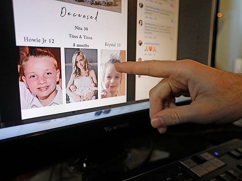Austin Cloes points to a photo of relatives Rhonita Miller and her family, who were killed in Mexico.