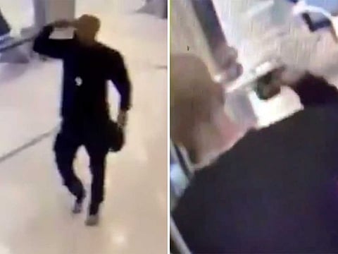 The young man was pointing a gun to his head.