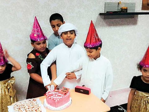 Six of the siblings during a birthday party. The children — four girls and three boys — were aged between five and 13.