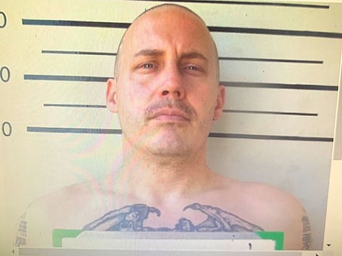 In this undated image made from a digital screen released by Thailand's Department of Corrections, shows a police custody photo of American citizen Bart Allen Helmus, 40 years old, after being arrested on drug charges. Helmus was among three prisoners who staged a violent escape from a courthouse in Thailand has shot and injured himself and his wife as police surrounded them Wednesday, Nov. 6, 2019.