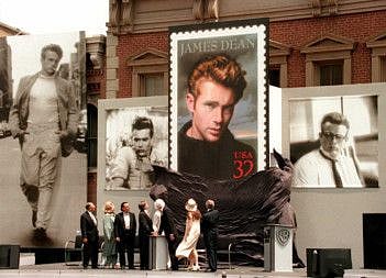 (FILES) In this file photo taken on June 23, 1996, Warner Brothers studio and US Postal Service officials watch as the James Dean stamp is unveiled on the Warner Brother's Midwestern Street studio lot 24 June in Burbank, California. More than 60 years after his death, movie legend James Dean is set to return to the screen thanks to special effects that recreate his image from old footage and photographs.
Dean, who died aged 24 in a car crash in 1955, has been "posthumously cast" in Vietnam War action-drama "Finding Jack," the Hollywood Reporter said on November 6, 2019. Production house Magic City Films obtained the rights to use Dean's image from his family for the screen adaption of Gareth Crockers 2008 novel.
/ AFP / MIKE NELSON