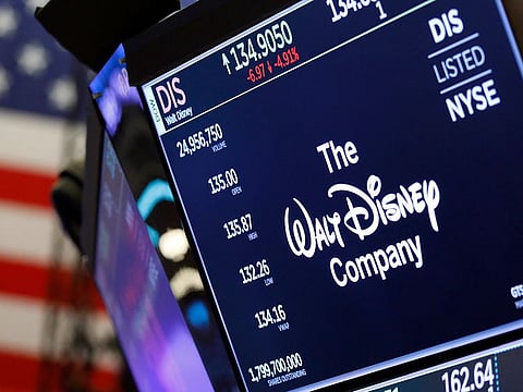 The logo for The Walt Disney Company appears above a trading post on the floor of the New York Stock Exchange.