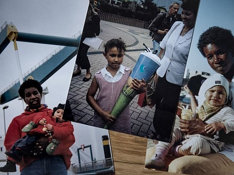 Family photos kept by Abenaa Adomako, left, whose family has been in Germany since the 1890s, in Berlin.