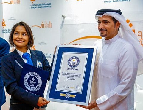 Ahmed bin Rakkad Al Ameri, Chairman of Sharjah Book Authority (SBA), receiving the Guinness World Record certificate the from organisation’s representatives.