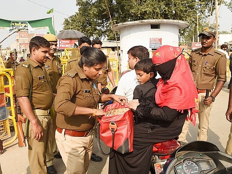 Police personnel conduct searches near the site of disputed Ram Janambhoomi-Babri Masjid site, on Friday, November 8, 2019.