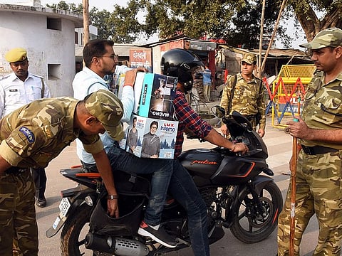File image: Paramilitary personnel checking vehicles as the security situations geared up after the verdict, in Ayodhya