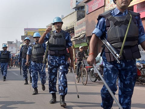 Rapid Action Force (RAF) personnel patrol in a street as a precautionary measure in view of Supreme Court's historic verdict on the Ayodhya land case, in Ayodhya.
