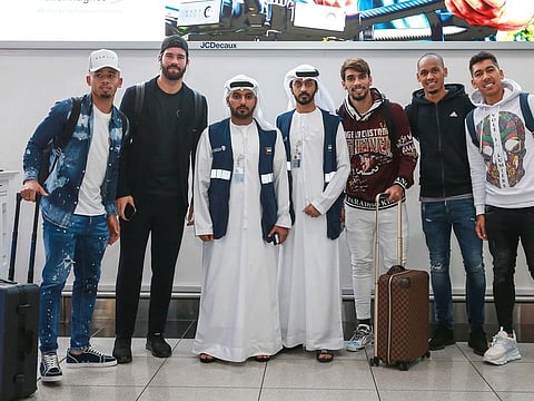 Members of the Brazil national team: Gabriel Jesus, Alisson, Lucas Paqueta, Fabinho and Roberto Firmino with local officials on their arrival at the Abu Dhabi airport.