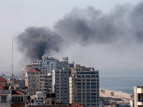 Smoke billows in Gaza City following an Israeli strike on November 12, 2019. Israel's military killed a commander for Palestinian militant group Islamic Jihad in a strike on his home in the Gaza Strip, prompting retaliatory rocket fire and fears of a severe escalation in violence. / AFP / MAHMUD HAMS