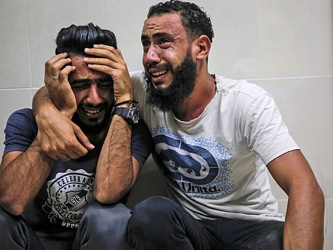 Relatives of Palestinian Zaki Ghanama, 25, mourn in the morgue of a hospital in Beit Lahia in the northern Gaza Strip on November 12, 2019, following an Israeli strike