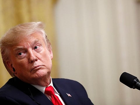 President Donald Trump listens during a news conference with Turkish President Recep Tayyip Erdogan in the East Room of the White House