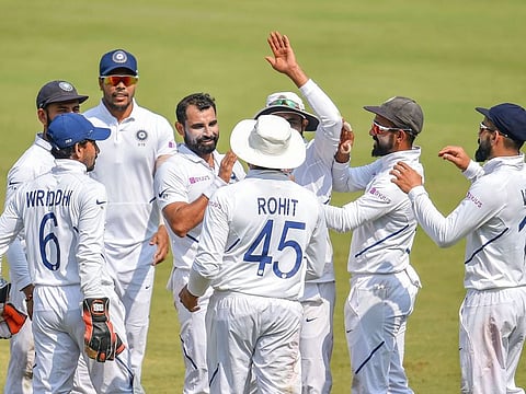 Indian speedster Mohammed Shami (fourth from left) celebrates with his teammates after capturing one of his four wickets in Indore today.