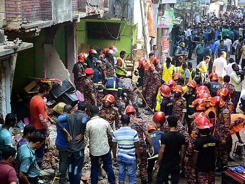 Rescue workers are seen at the site of a gas pipeline explosion in the port city of Chittagong
