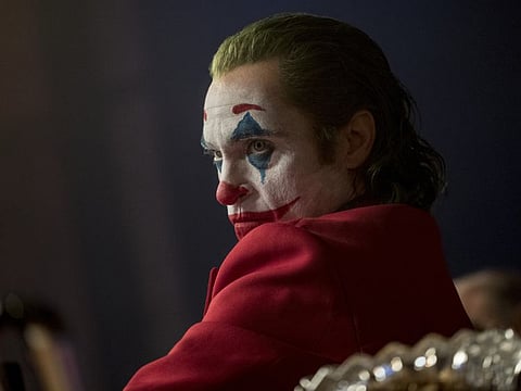 This image released by Warner Bros. Pictures shows Joaquin Phoenix in a scene from the film "Joker."