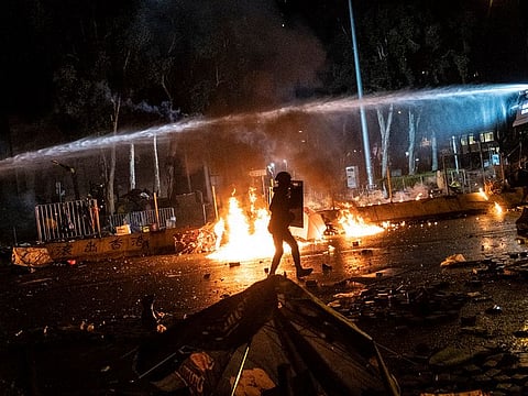 Protesters clash with riot police officers near the Hong Kong Polytechnic University in November.