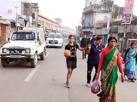People walking on the road during the tight security setup at Hanuman Garhi in Ayodhya on Saturday. A five-judge bench of the Supreme Court delivered the verdict in Ayodhya land case