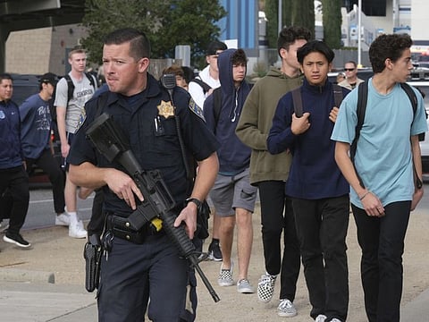 Students are escorted off of campus at Saugus High after a shooting occurred around 7:30 at Saugus high in Santa Clarita, CA Thursday, November 14, 2019. (Photo by David Crane, Los Angeles Daily News/SCNG)