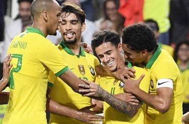 Brazil's star midfielder Philippe Coutinho (centre) celebrates with his teammates after scoring a goal against South Korea during their friendly at Mohammed Bin Zayed Stadium in Abu Dhabi.