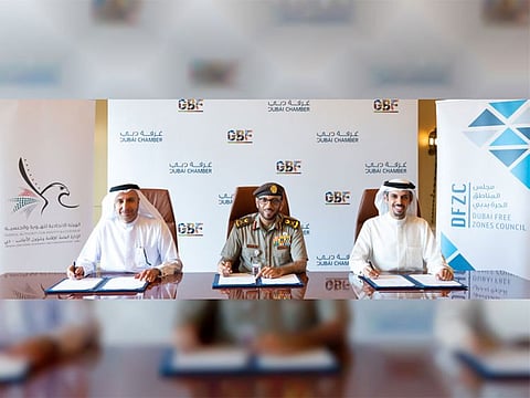 From left: Dr. Mohammed Al Zarooni, Secretary-General of Dubai Free Zones Council; Major General Mohamed Ahmed Al Marri, Director-General of GDRFA, and Hamad Buamim, President and CEO of Dubai Chamber.