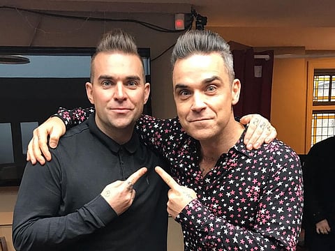 Tony Lewis, left, and Robbie Williams.