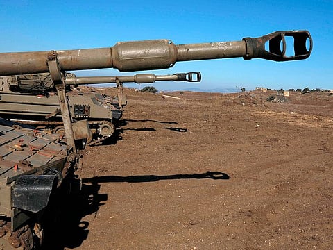 Israeli armoured vehicles are pictured on November 19, 2019 near the border with Syria in the Occupied Golan Heights.