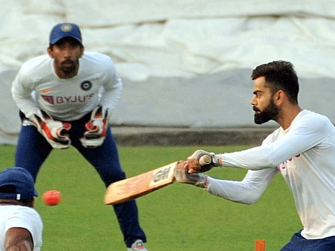 Indian skipper Virat Kohli gives catching practice to his teammates with the pink ball at the Eden Gardens on Wednesday.
