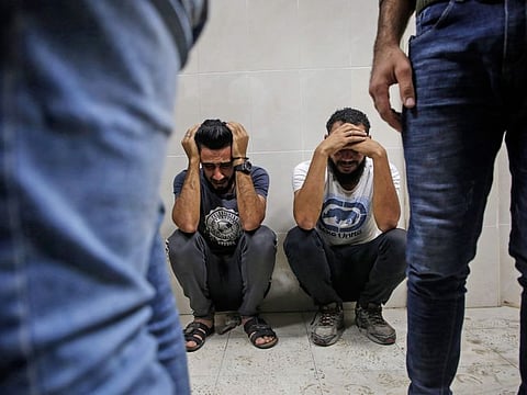 Relatives of Palestinian Zaki Ghanama, 25, mourn in the morgue of a hospital in Beit Lahia in the northern Gaza Strip on November 12, 2019, following an Israeli strike.